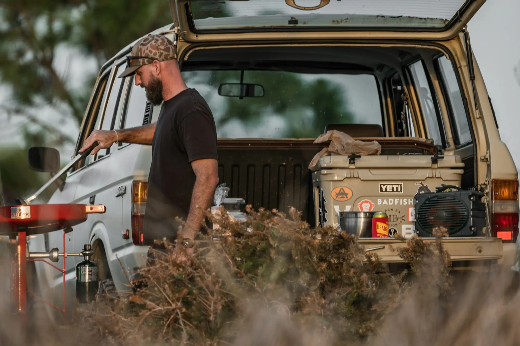 Tradesperson standing beside his ute