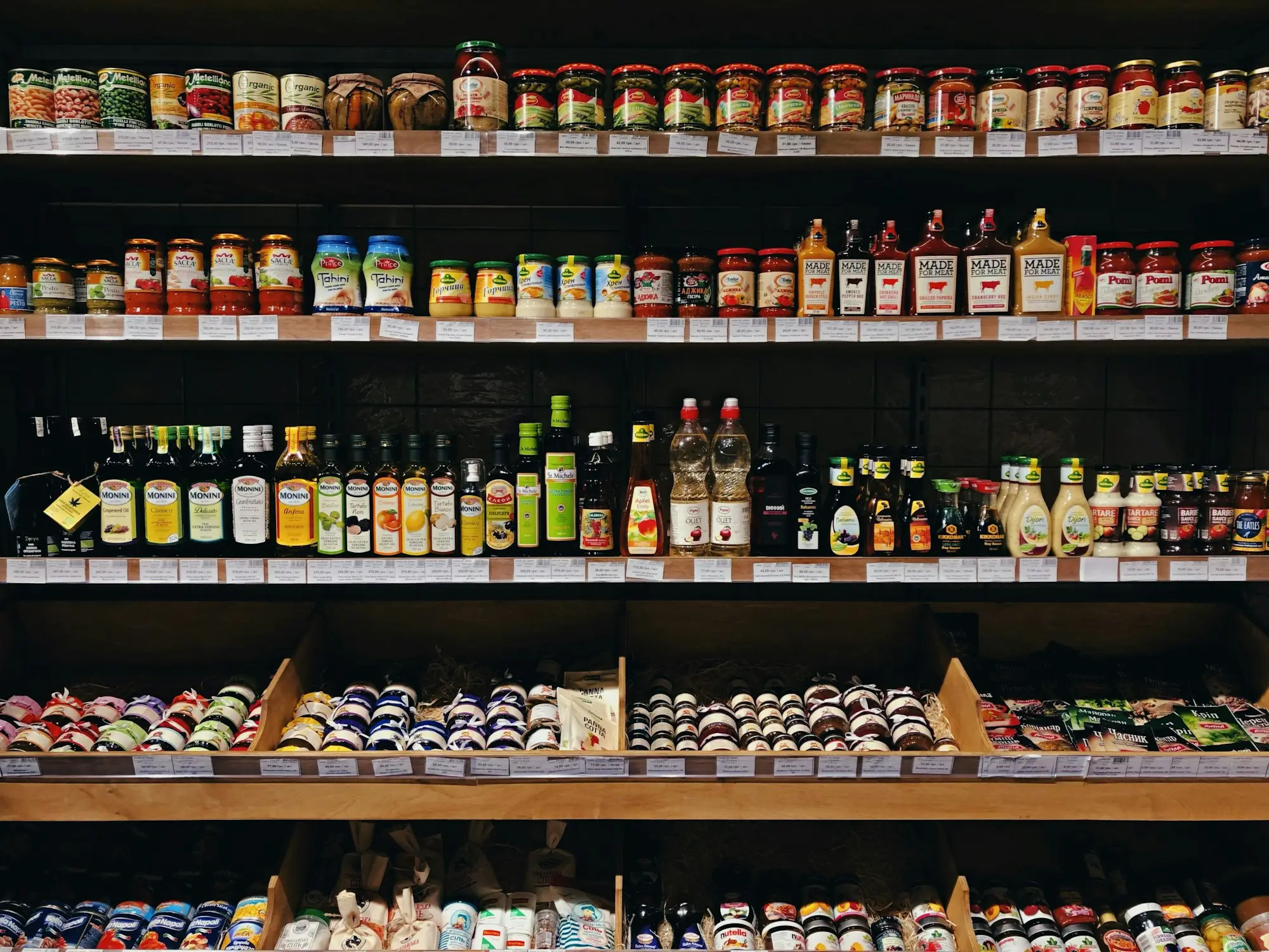 Deli shelves stocked with jars and bottles